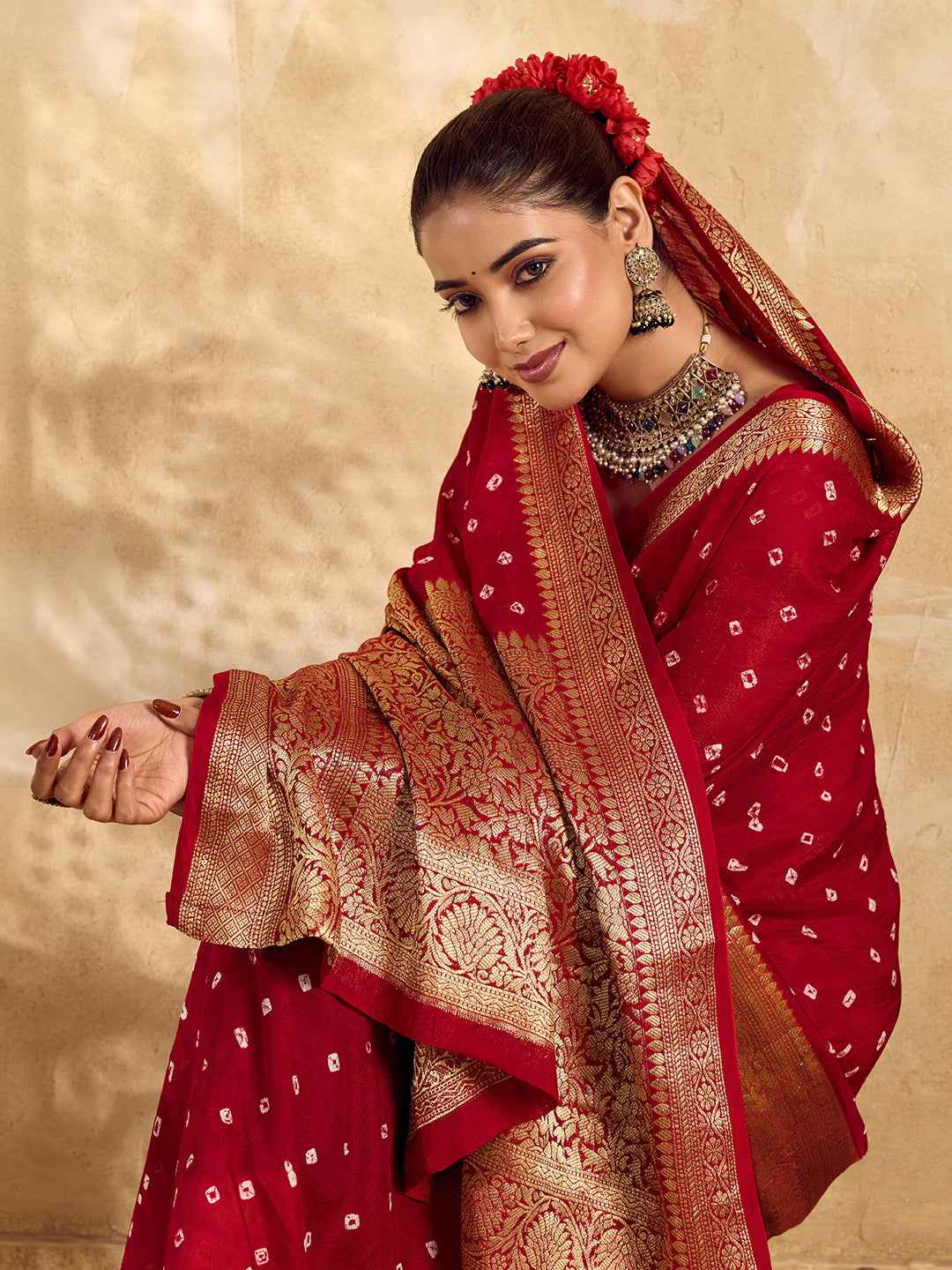 Buy red viscose silk saree with a bandhani pattern and zari border.