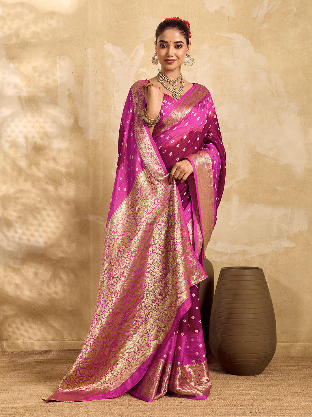 a red and pink Viscos silk bandhani saree with zari border and a pink blouse