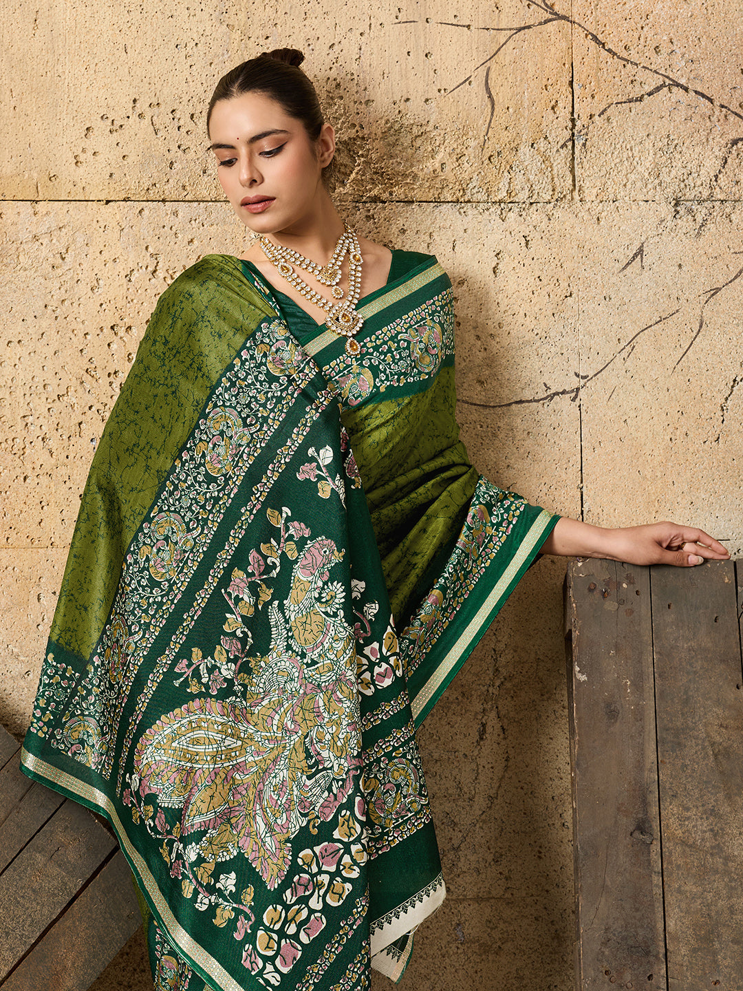A green saree with Silk Printed Style With Zari Border Work