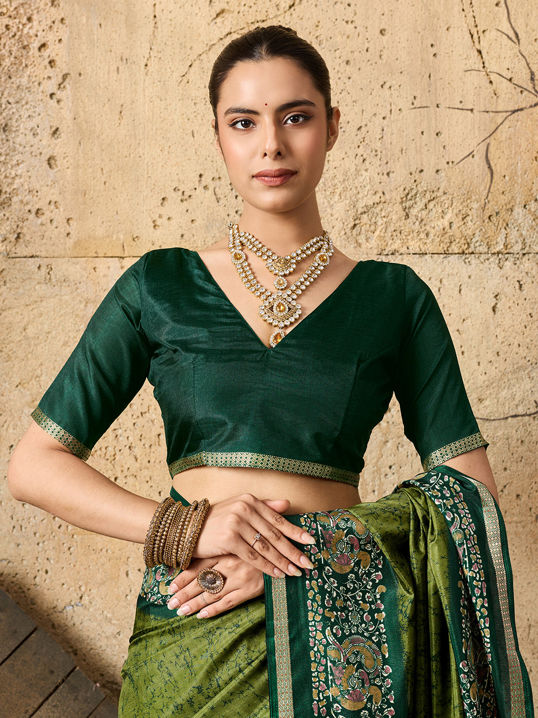 A green saree with Silk Printed Style With Zari Border Work