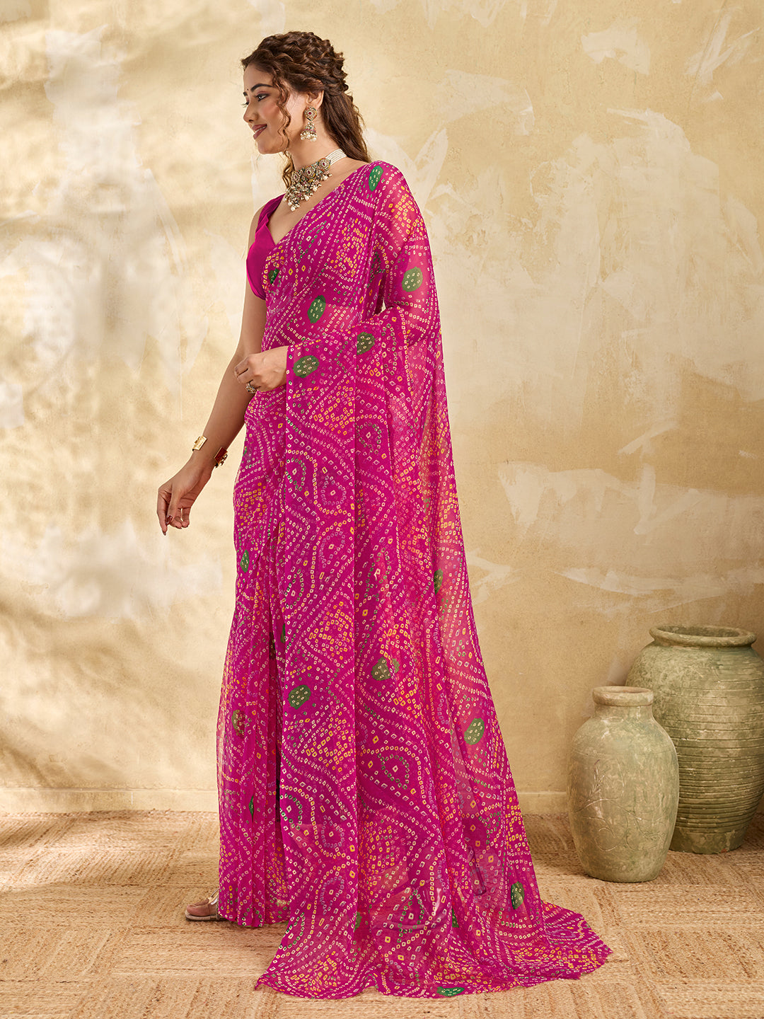 A rani colour geometric patterned saree with bandhani style dots under 500