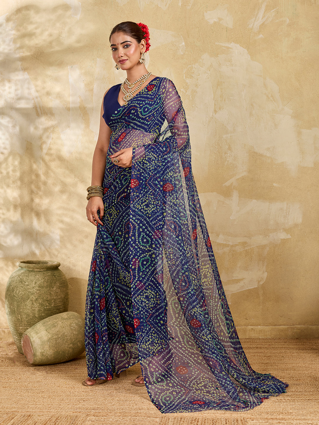 A blue colour geometric patterned saree with bandhani style dots under 500