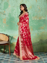 Woman in a red saree with gold borderTissue silk Banarasi Style
