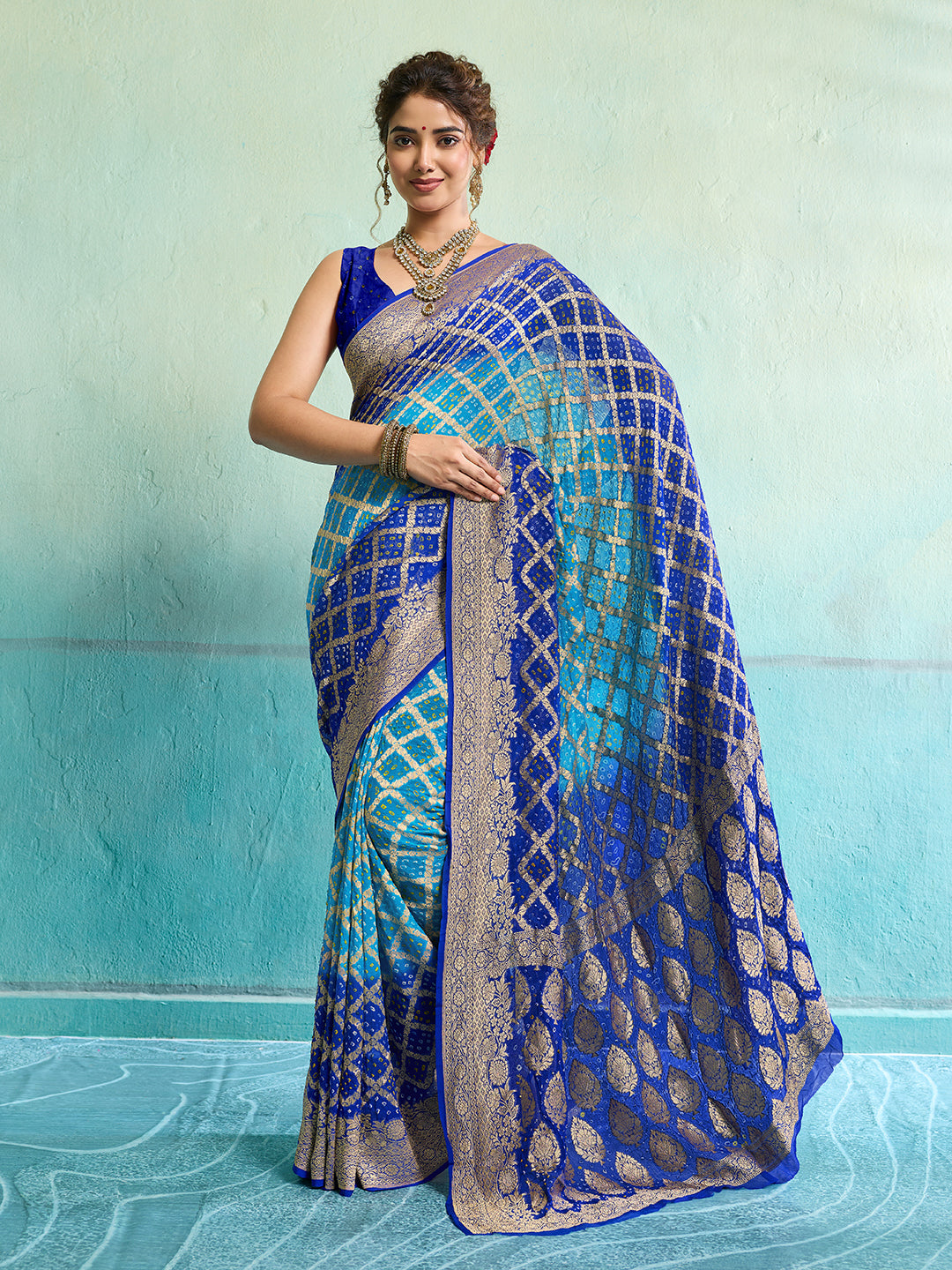 KcPc New Launch Pure Khaddi Georgette Upada Neemzari Bandhej SareeFirozi Blue
