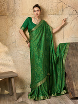 A green bandhani style chiffon georgette saree with a golden border and a matching green blouse piece,