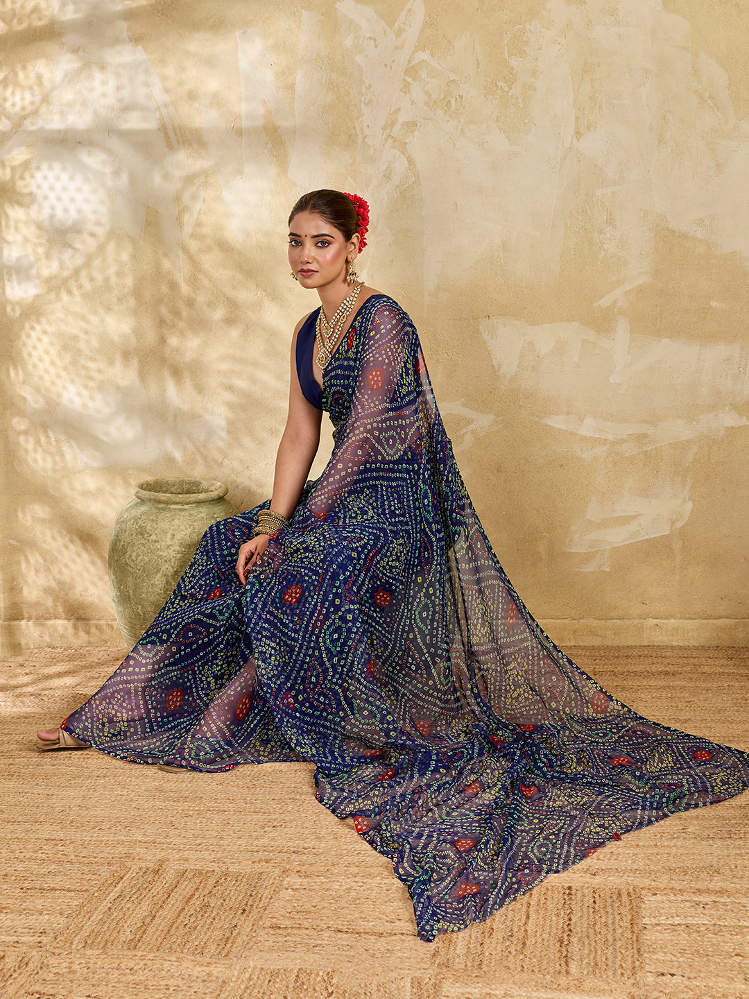 A blue colour geometric patterned saree with bandhani style dots under 500