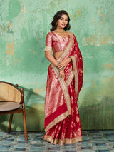 Woman in a red saree with gold borderTissue silk Banarasi Style