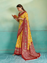 A yellow and red pashmina cotton silk saree with a patola style pattern