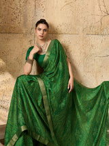 A green bandhani style chiffon georgette saree with a golden border and a matching green blouse piece,