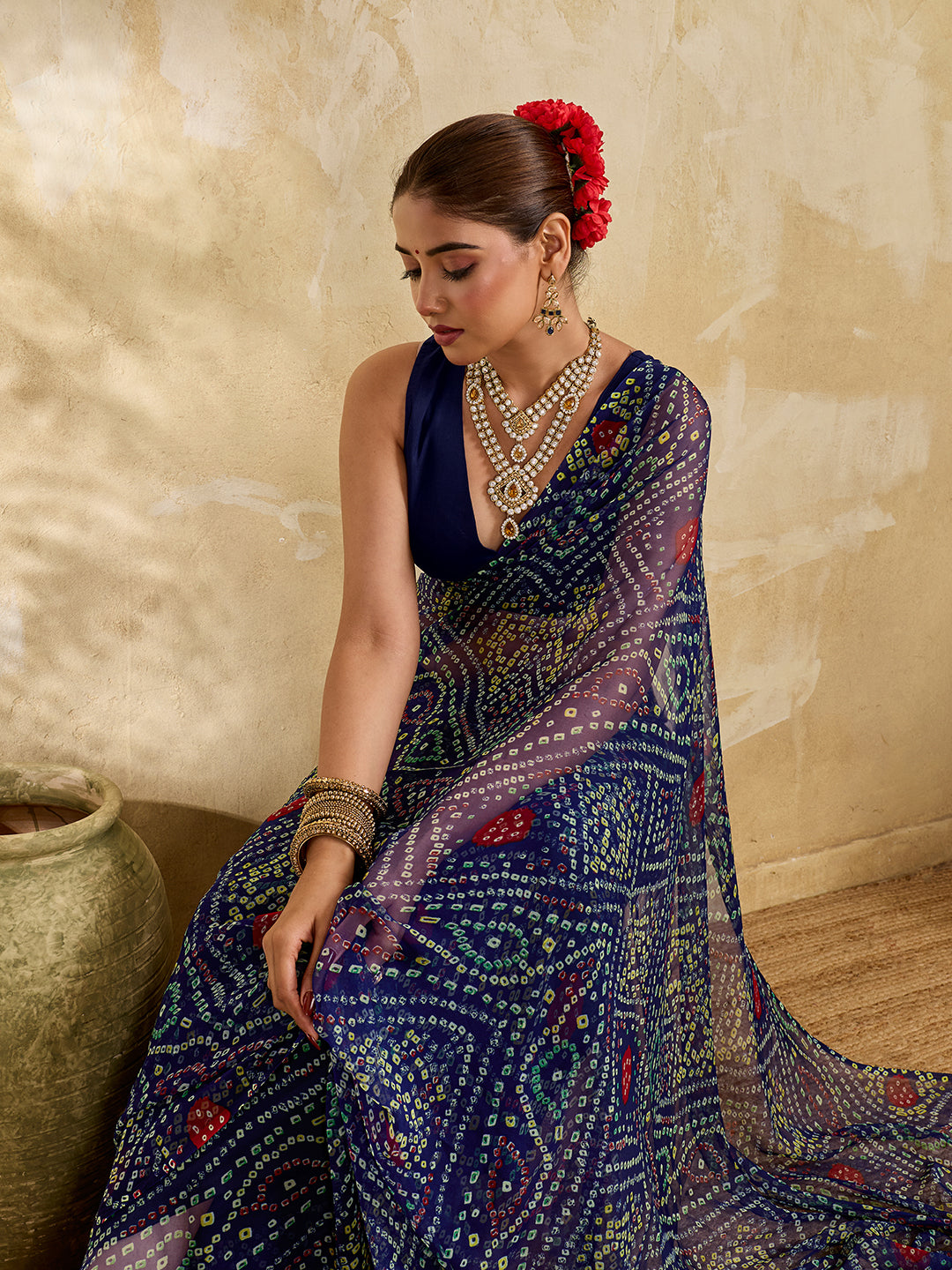A blue colour geometric patterned saree with bandhani style dots under 500
