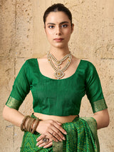A green bandhani style chiffon georgette saree with a golden border and a matching green blouse piece,