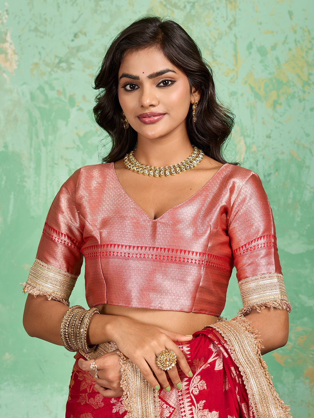 Woman in a red saree with gold borderTissue silk Banarasi Style