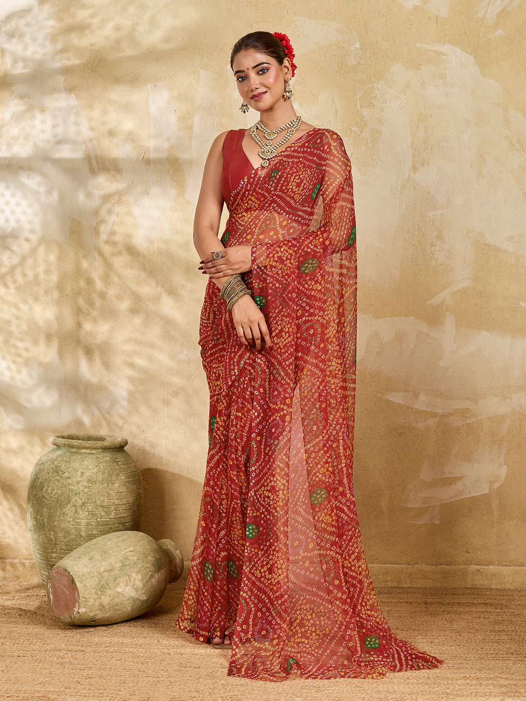 A red colour saree with bandhani style under 500