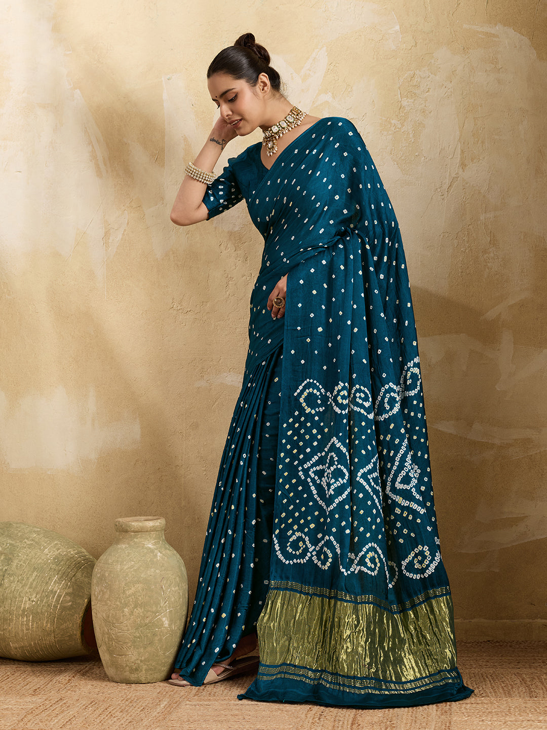A blue saree with bandhani print and a lagdi patla pallu,