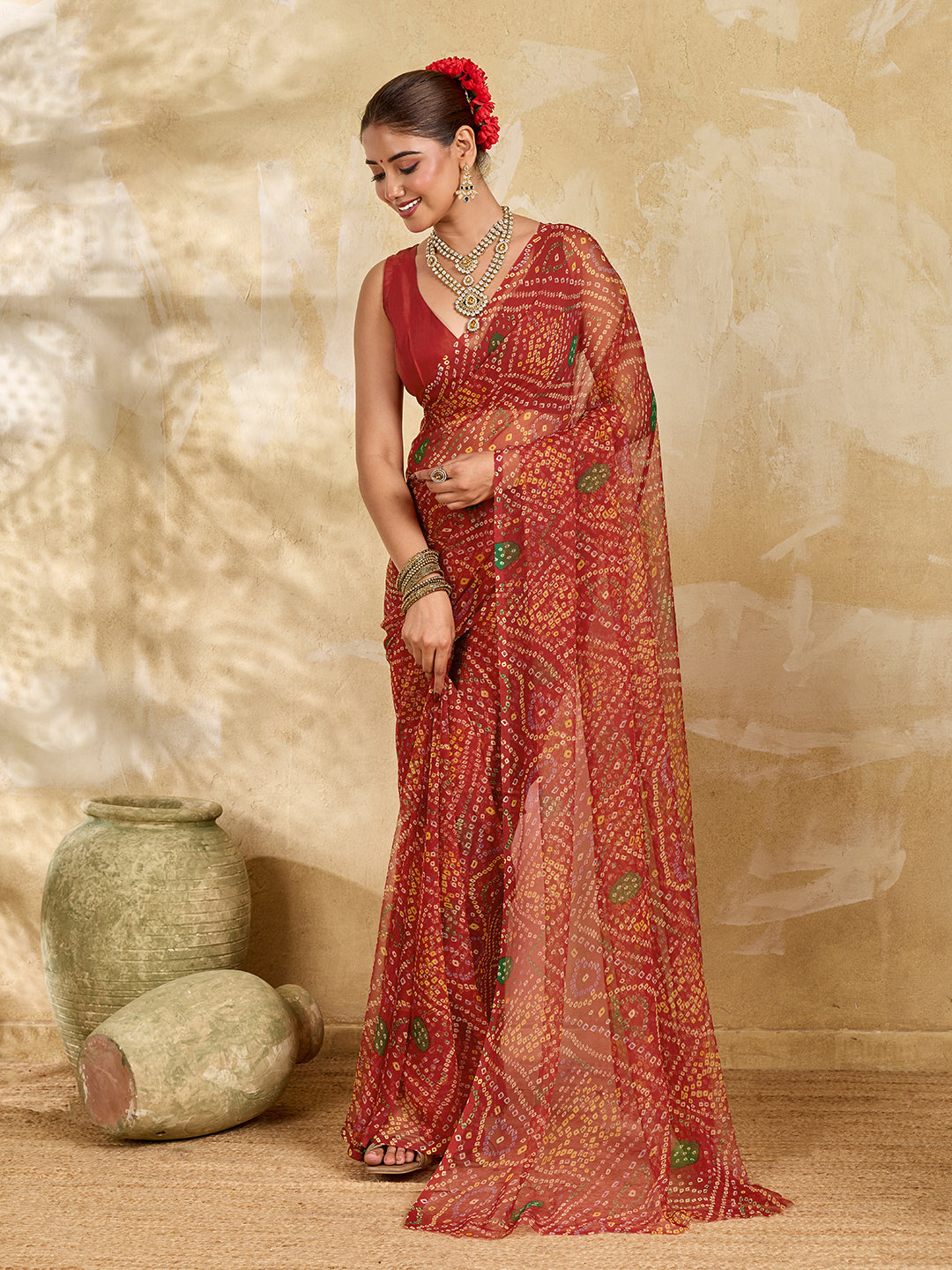 A red colour saree with bandhani style under 500