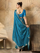 A blue chiffon georgette saree with bandhani print, featuring a sky blue color and decorative patterns, paired with a blue blouse.