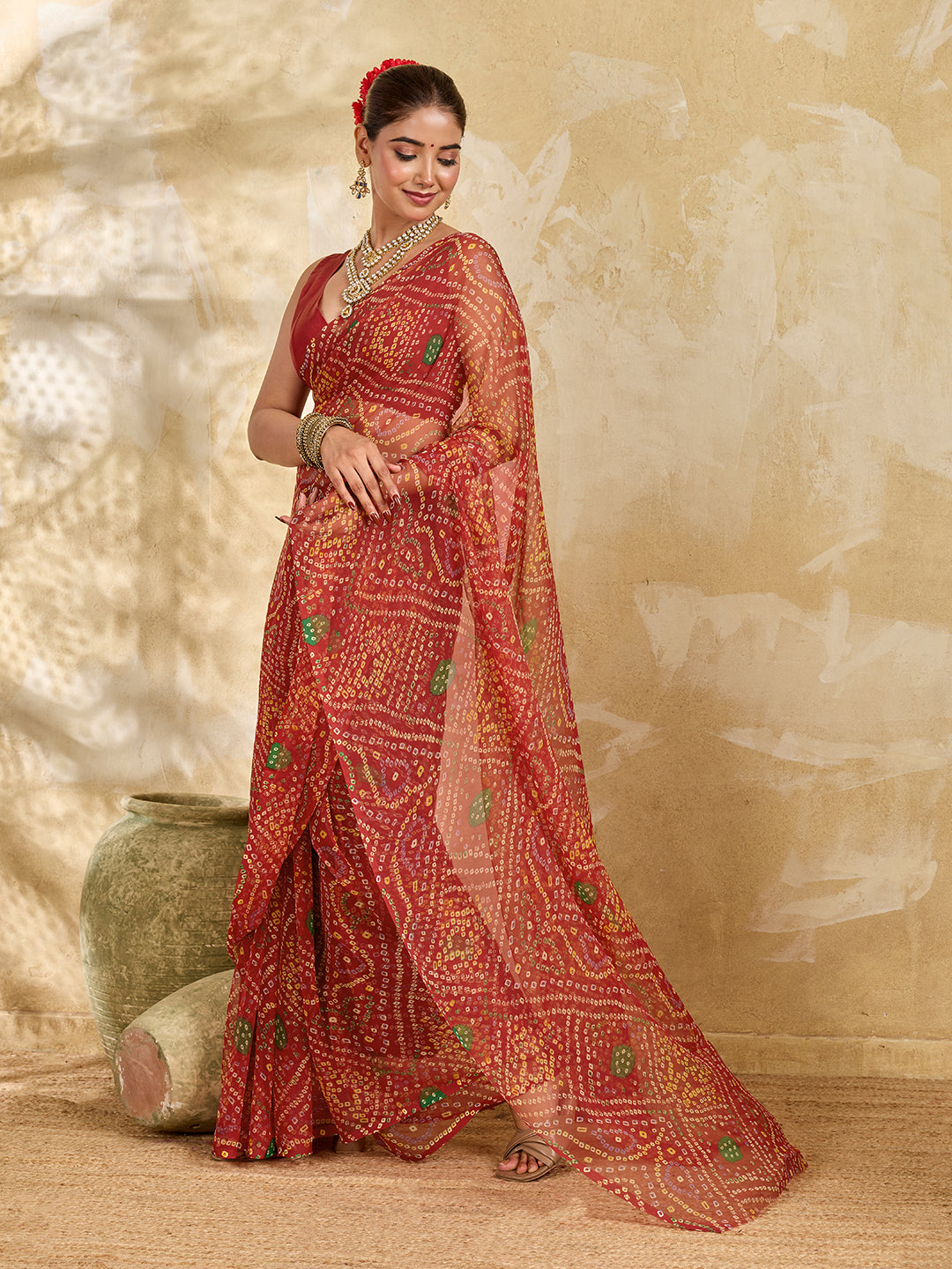 A red colour saree with bandhani style under 500