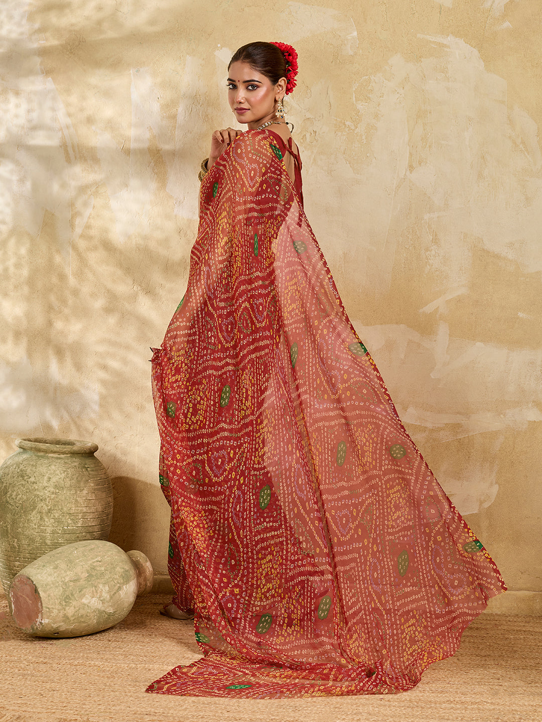 A red colour saree with bandhani style under 500