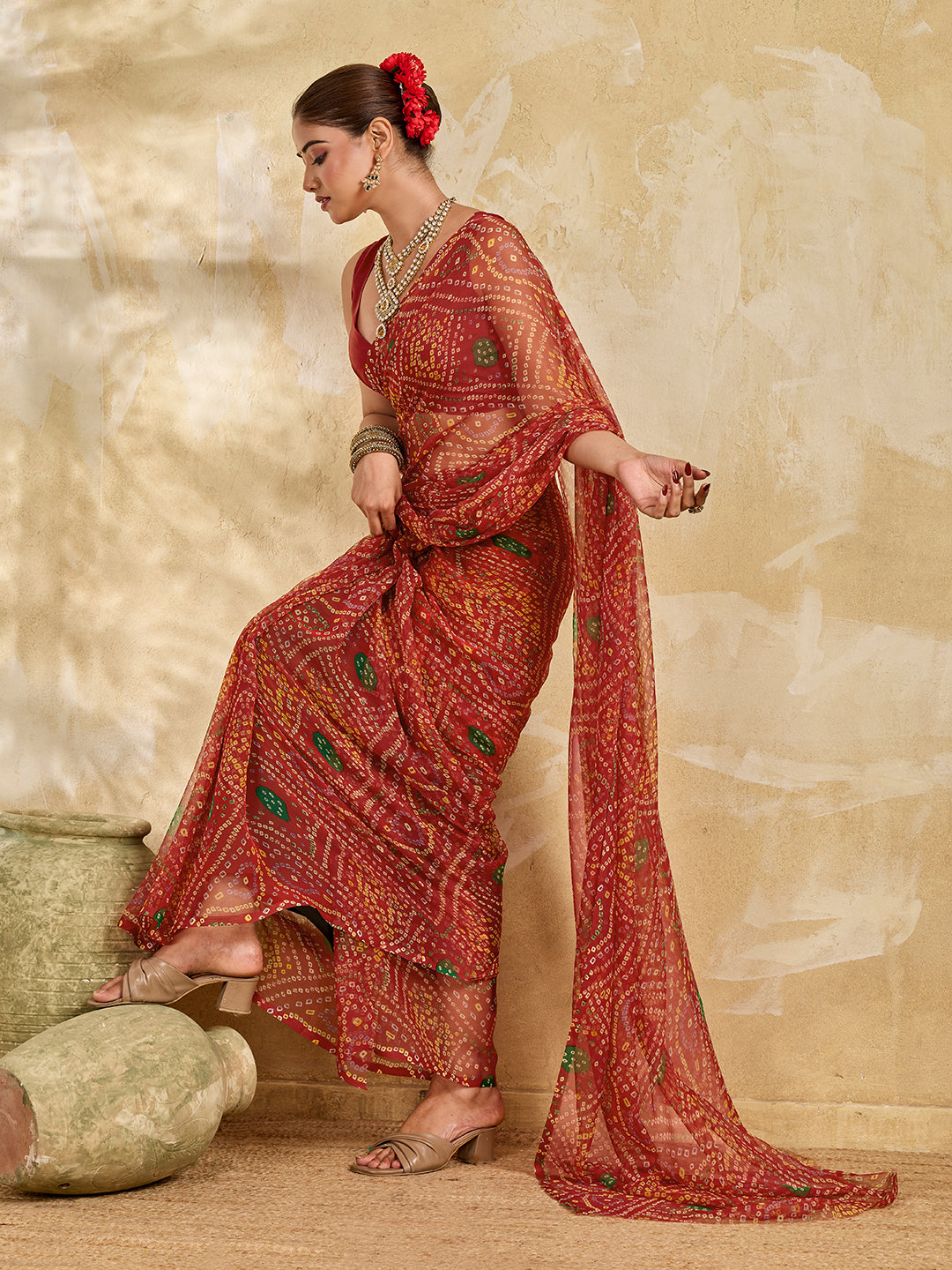 A red colour saree with bandhani style under 500
