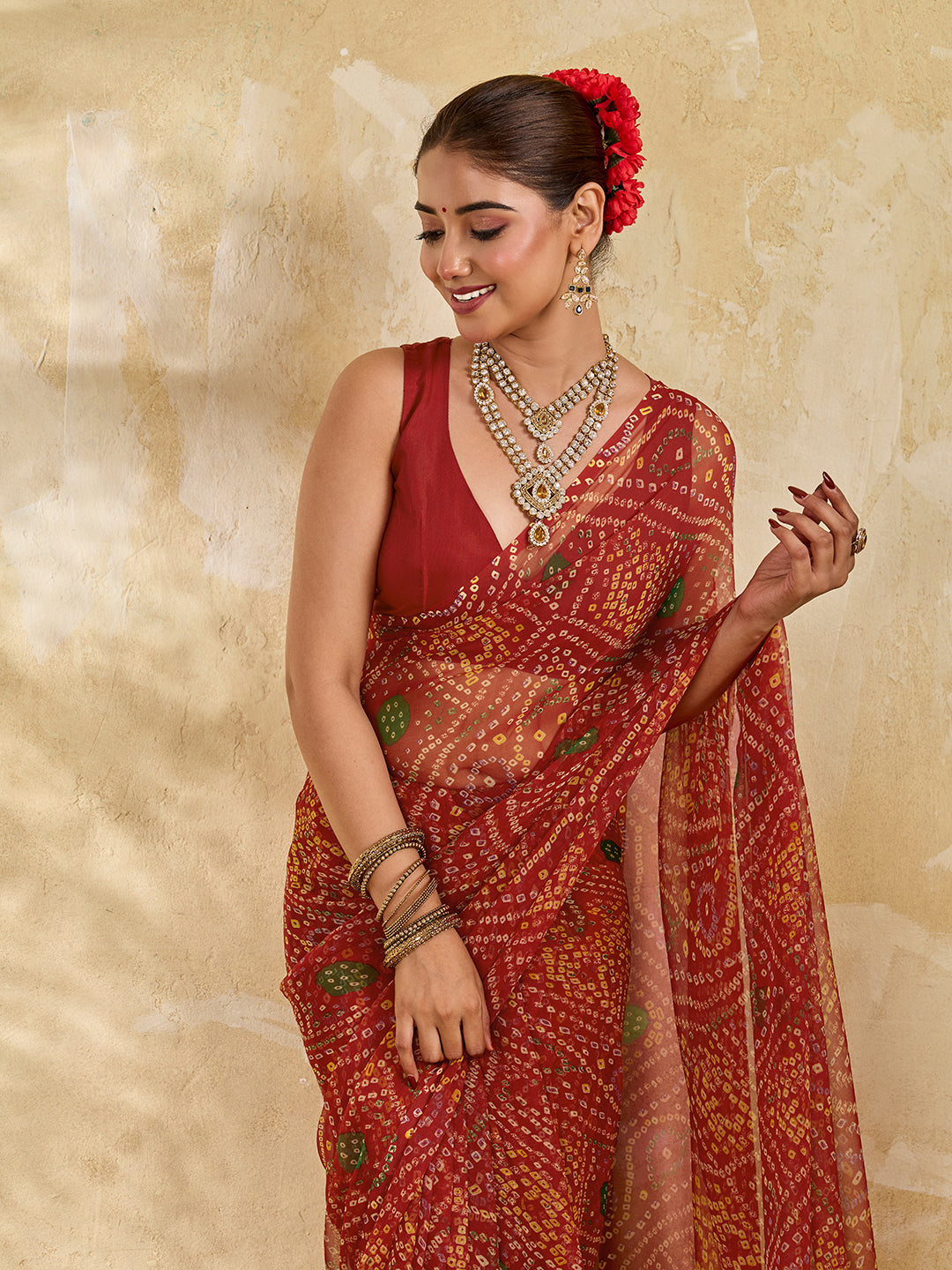 A red colour saree with bandhani style under 500
