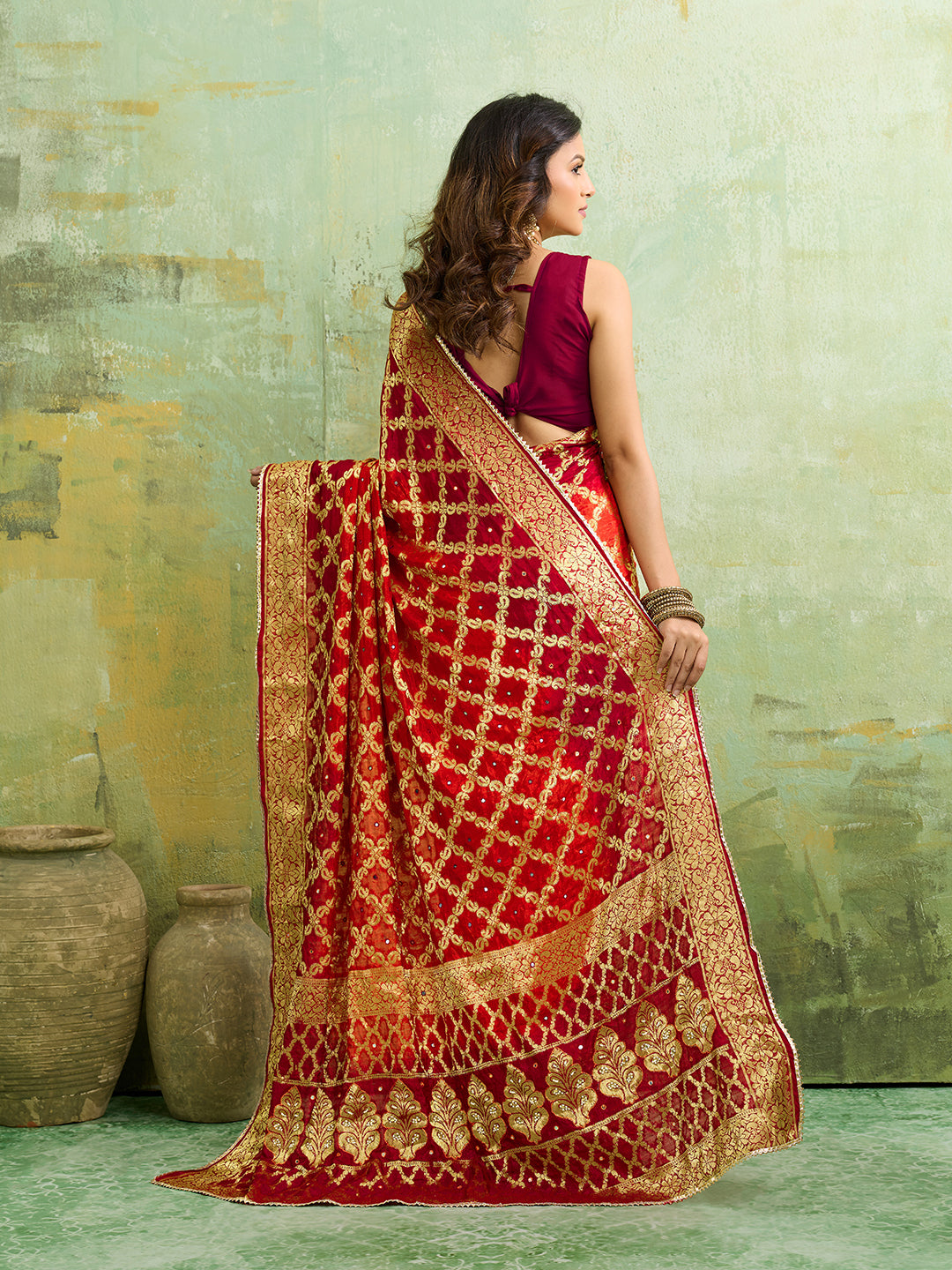 Banarasi silk saree with heavy zari work in orange and red color, with a traditional gharcholastyle