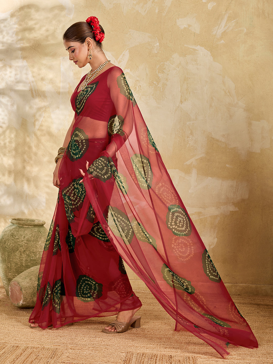 A bright red saree with bandhani print under 500