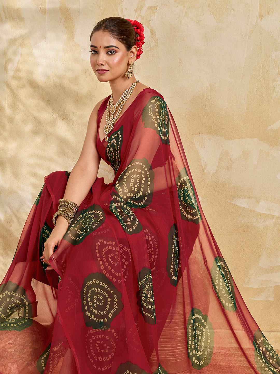 A bright red saree with bandhani print under 500