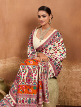 off-white saree with a floral and geometric pattern, featuring a heavy border and a small floral design on the fabric.