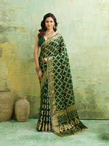 A bottle green Banarasi silk saree with heavy zari work and a gharchola pattern