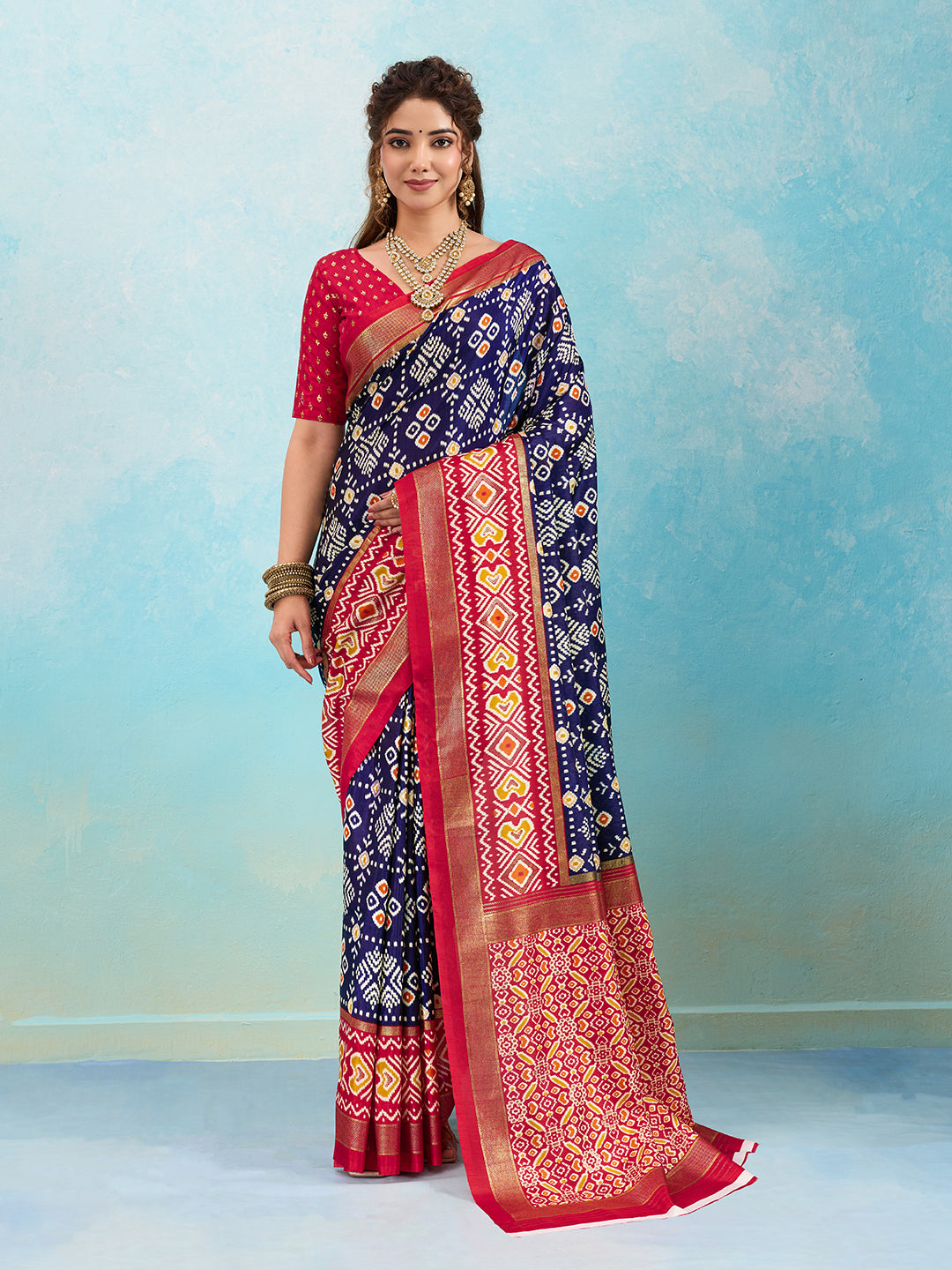 A blue and red pashmina cotton silk saree with a patola style pattern