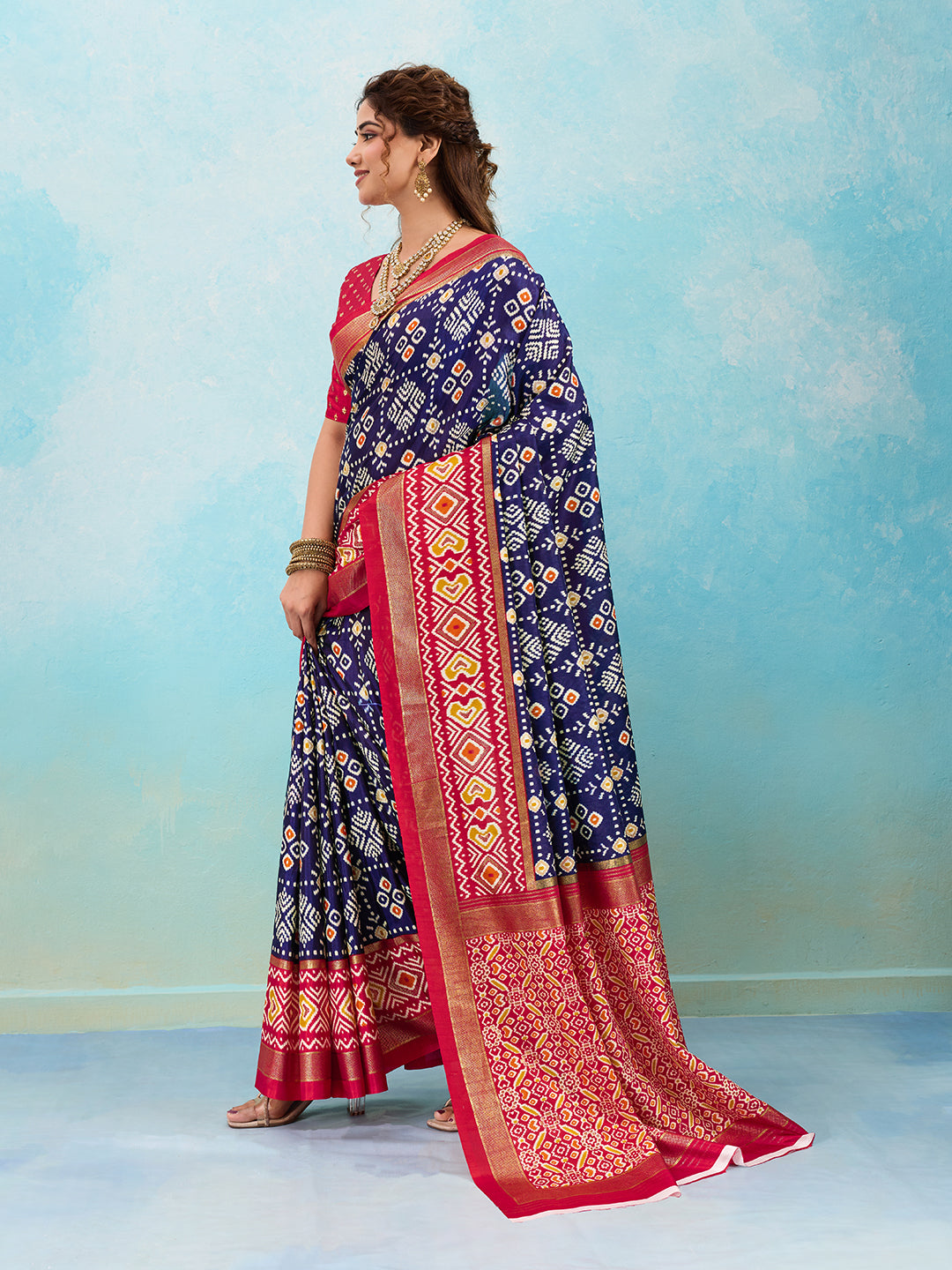 A blue and red pashmina cotton silk saree with a patola style pattern