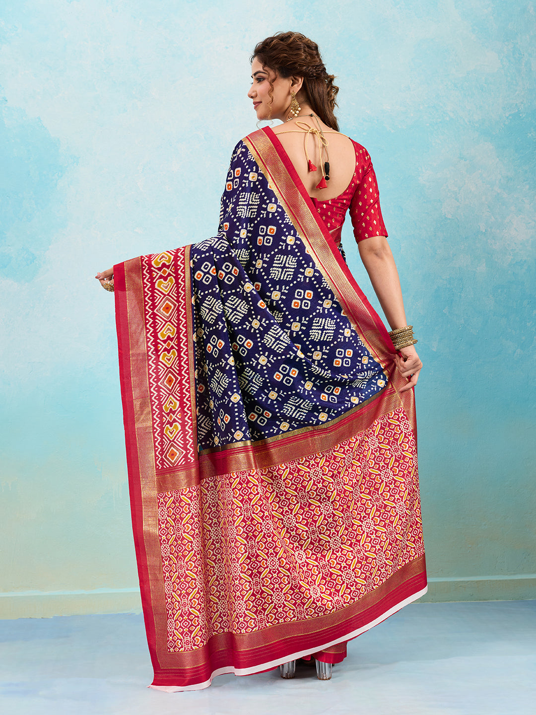 A blue and red pashmina cotton silk saree with a patola style pattern