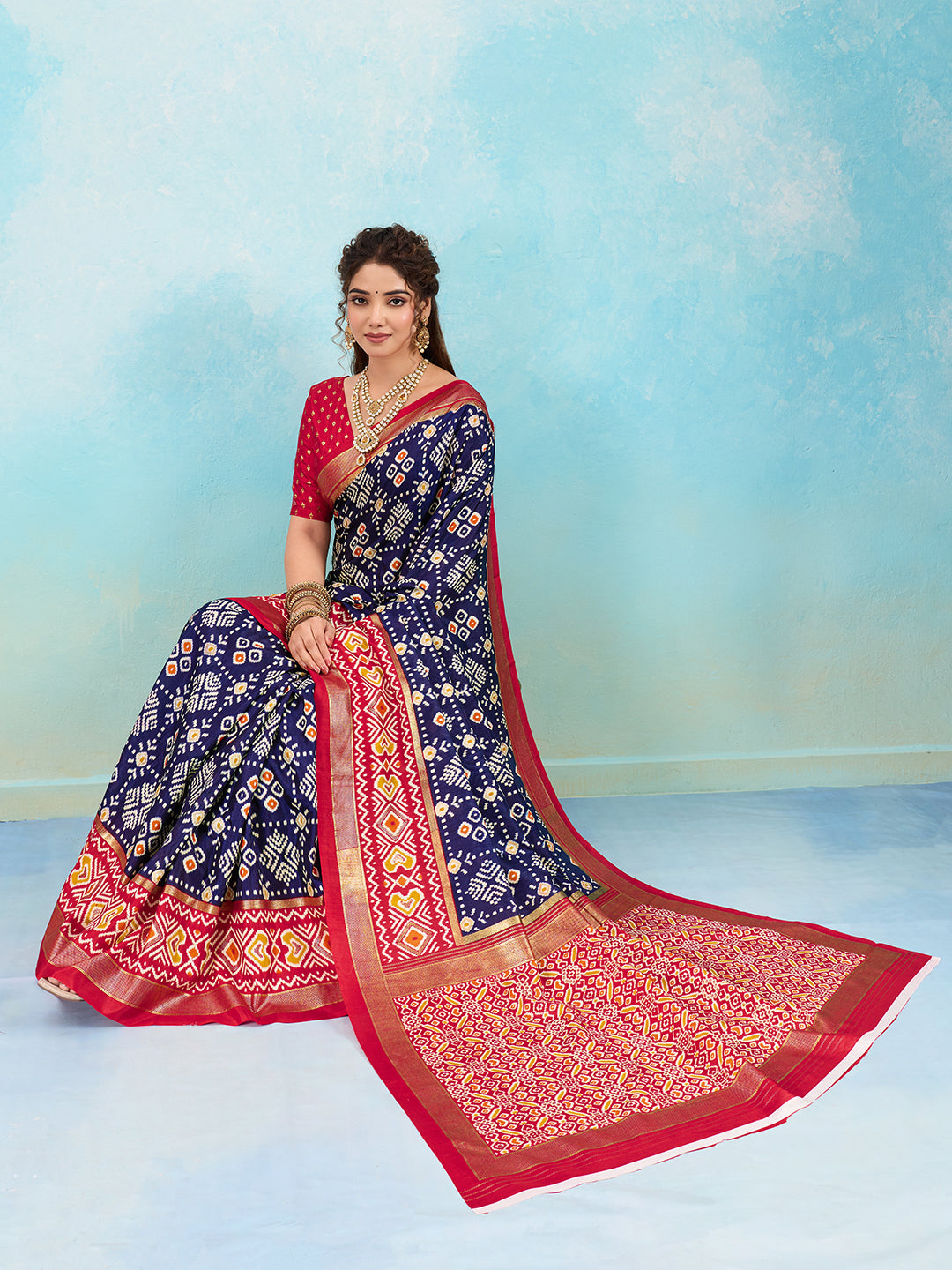 A blue and red pashmina cotton silk saree with a patola style pattern