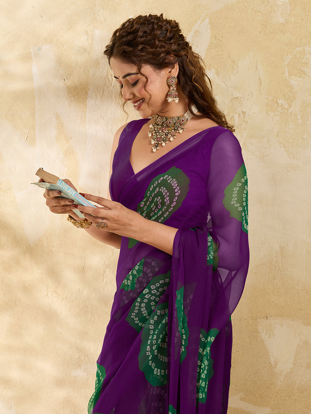 A wine colour saree with bandhani print under 500