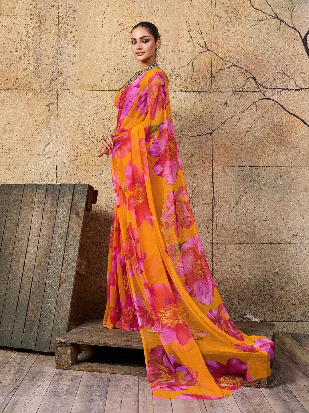 A vibrant orange and pink floral sareeGeorgette Flower Printed Style