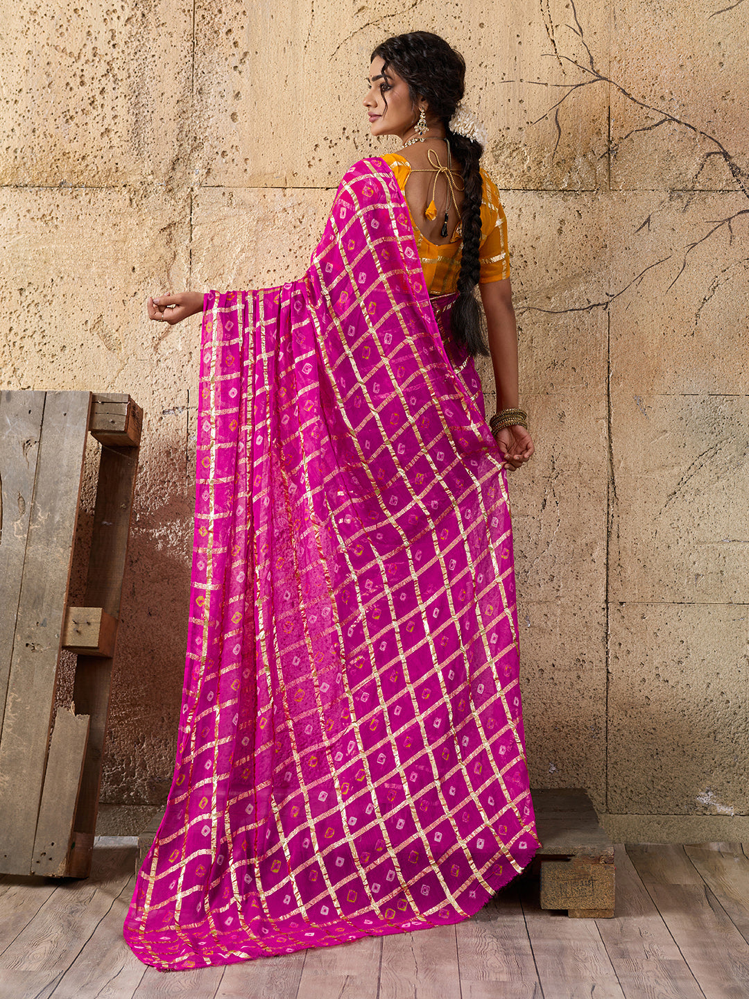 A party wear saree in Rani colour