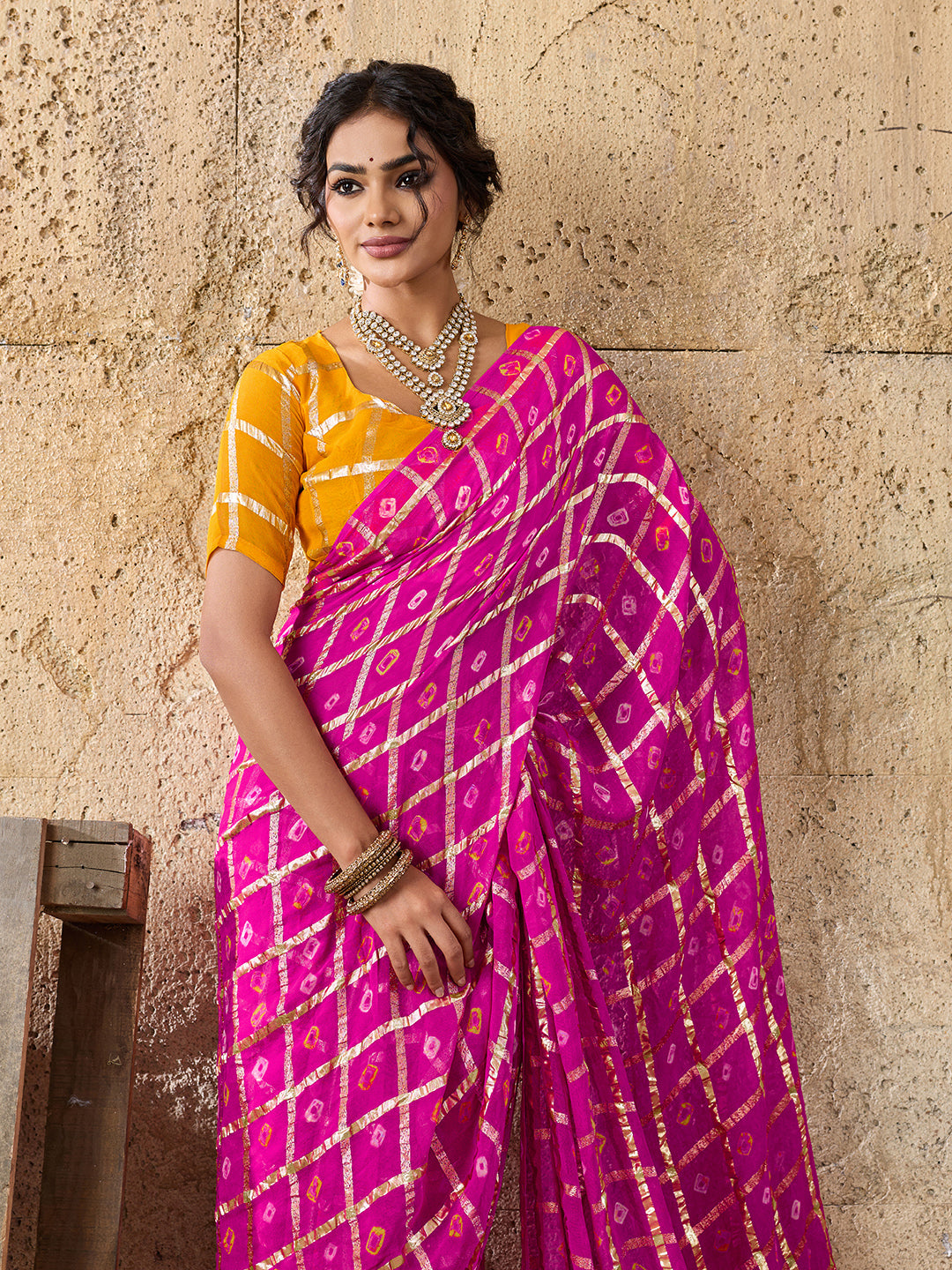 A party wear saree in Rani colour