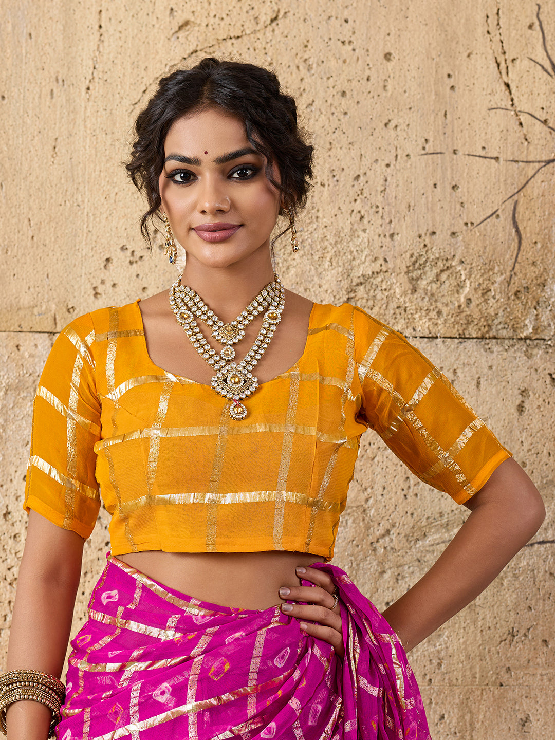A party wear saree in Rani colour