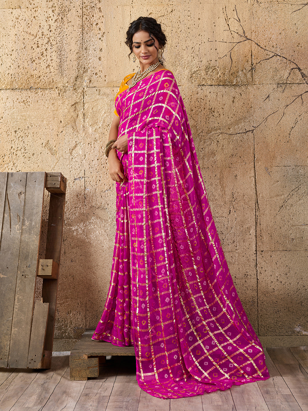 A party wear saree in Rani colour