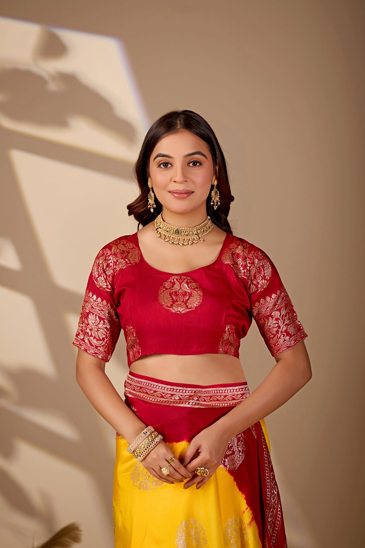 A yellow and red saree withPure Georgette Zari Faag Shadded Saree