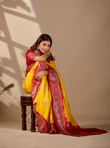 A yellow and red saree withPure Georgette Zari Faag Shadded Saree