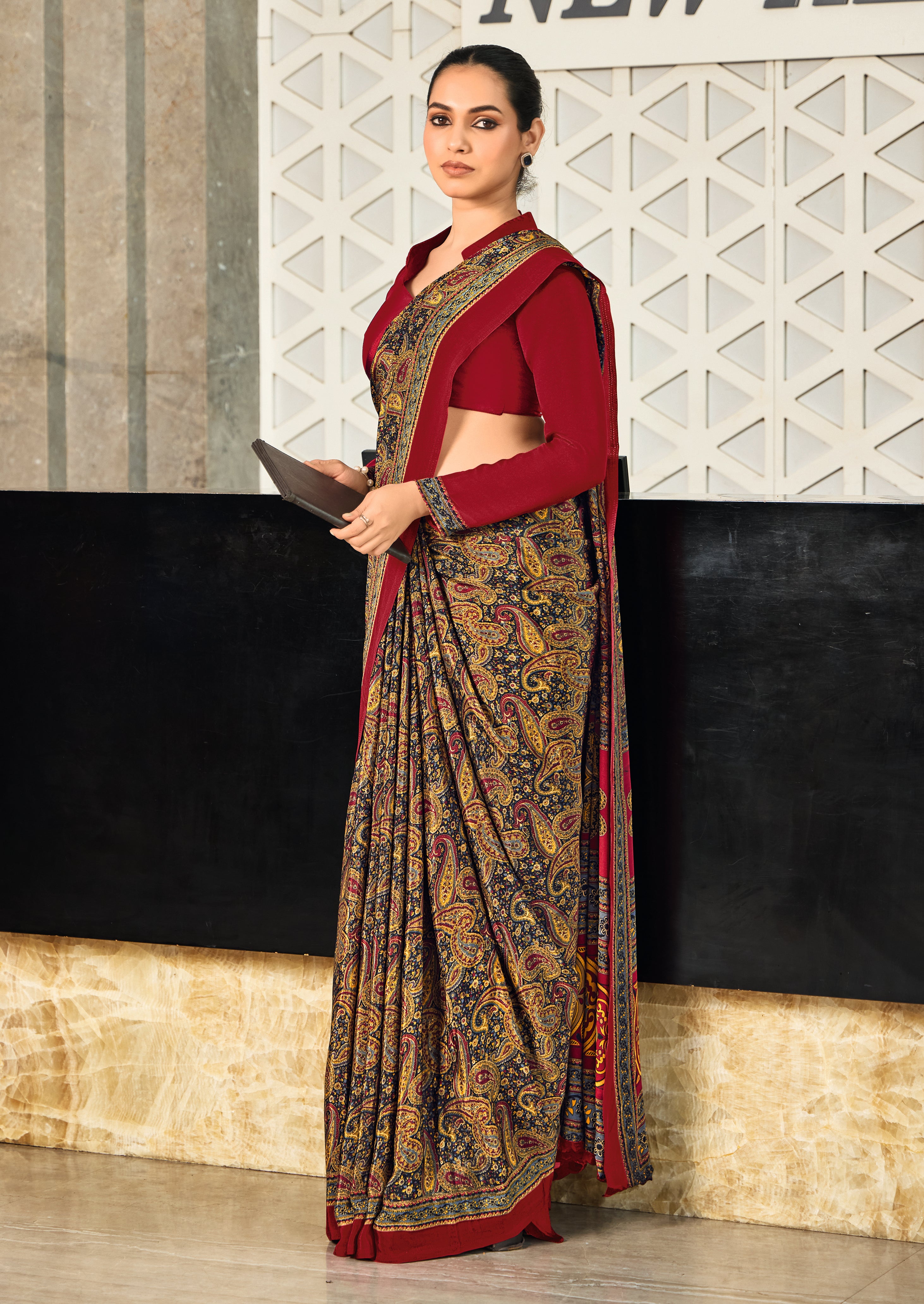 red and multicolor crepe silk saree with a geometric pattern and a red blouse under 1500