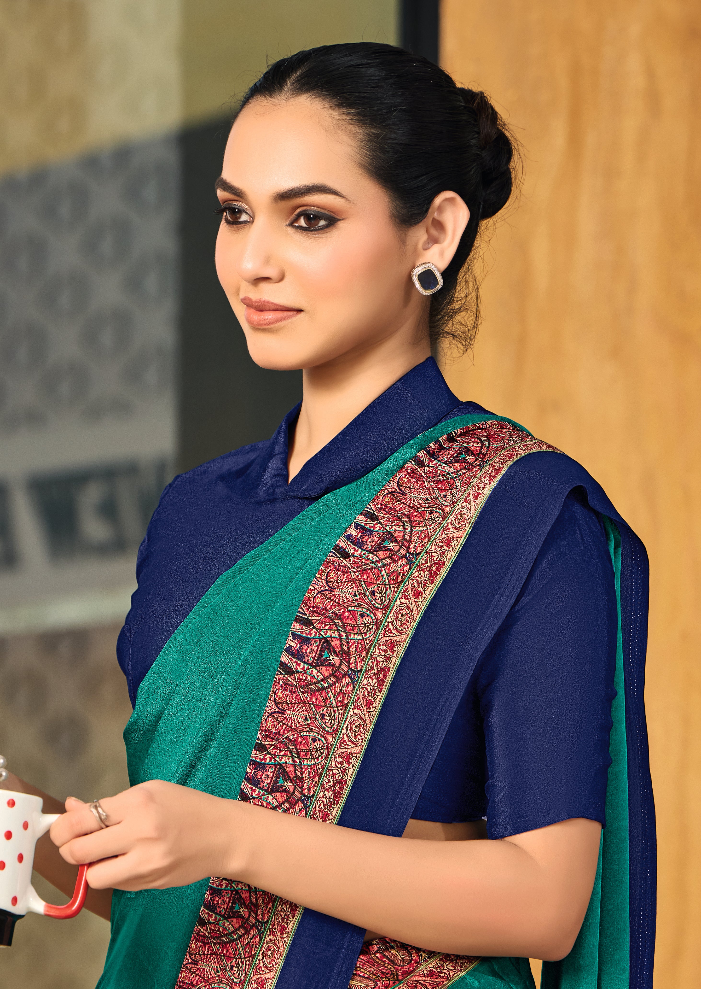 green and blue crepe silk saree with a red border under 1500
