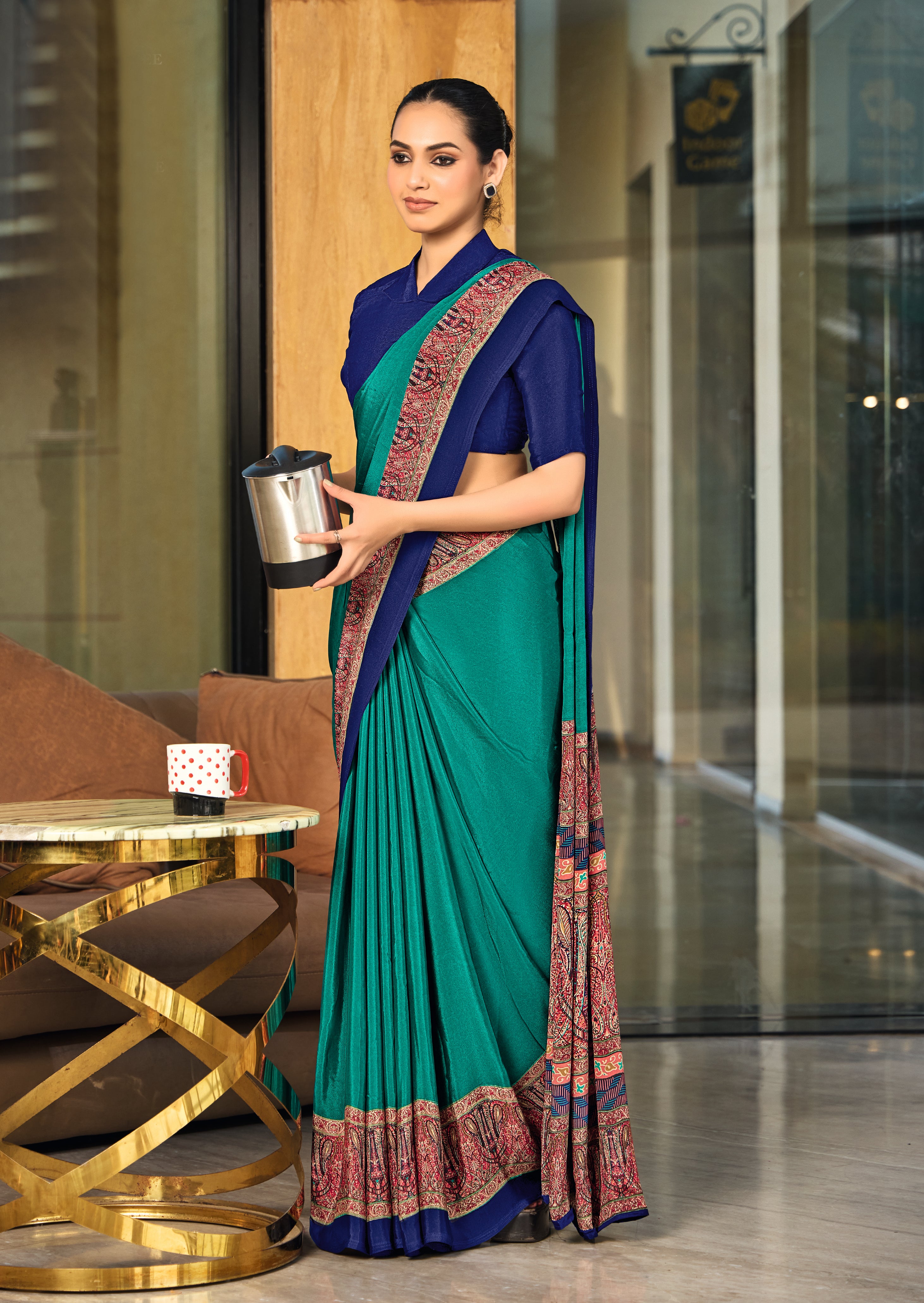 green and blue crepe silk saree with a red border under 1500