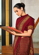 maroon crepe silk saree with a floral pattern under 1500