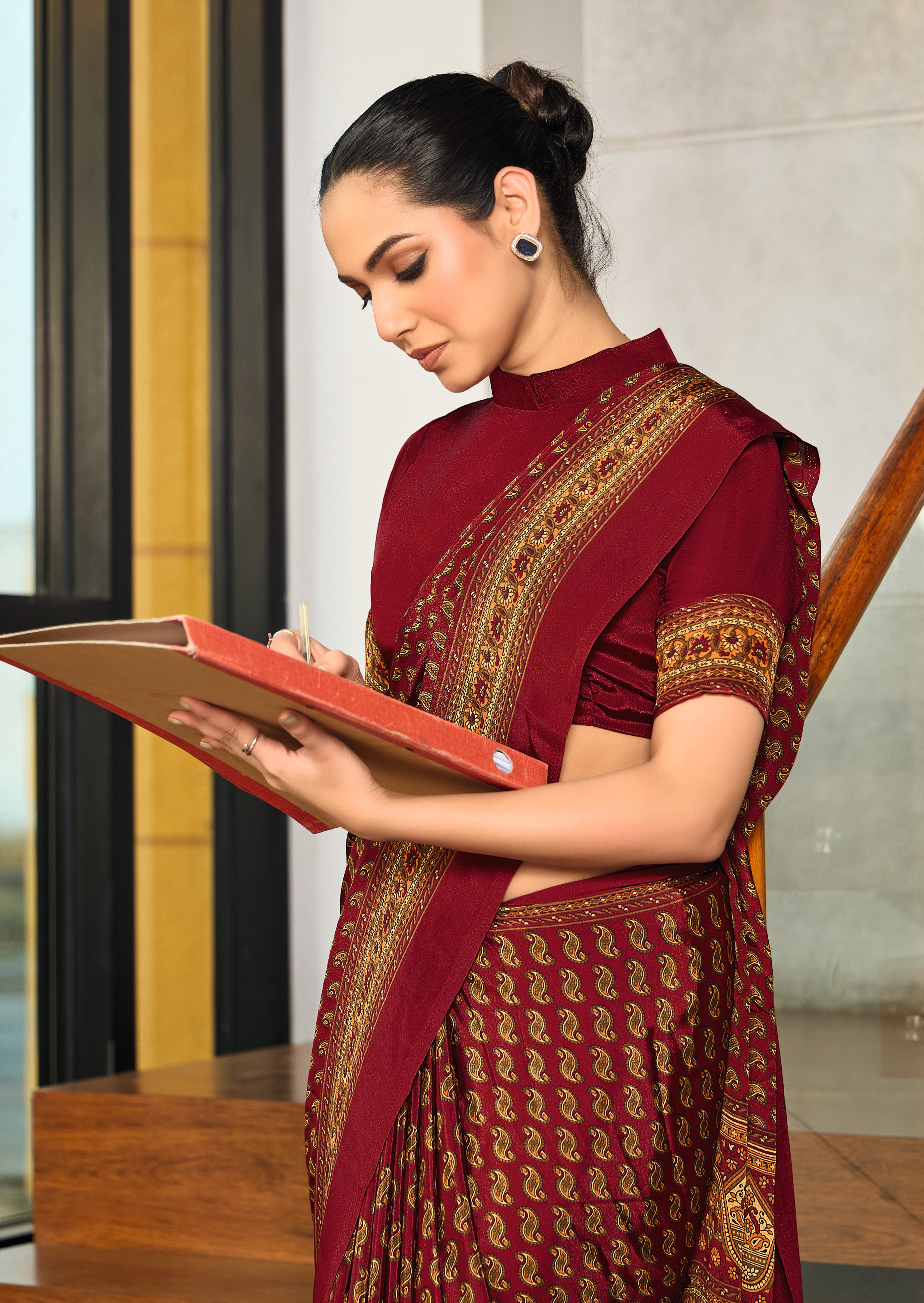 maroon crepe silk saree with a floral pattern under 1500