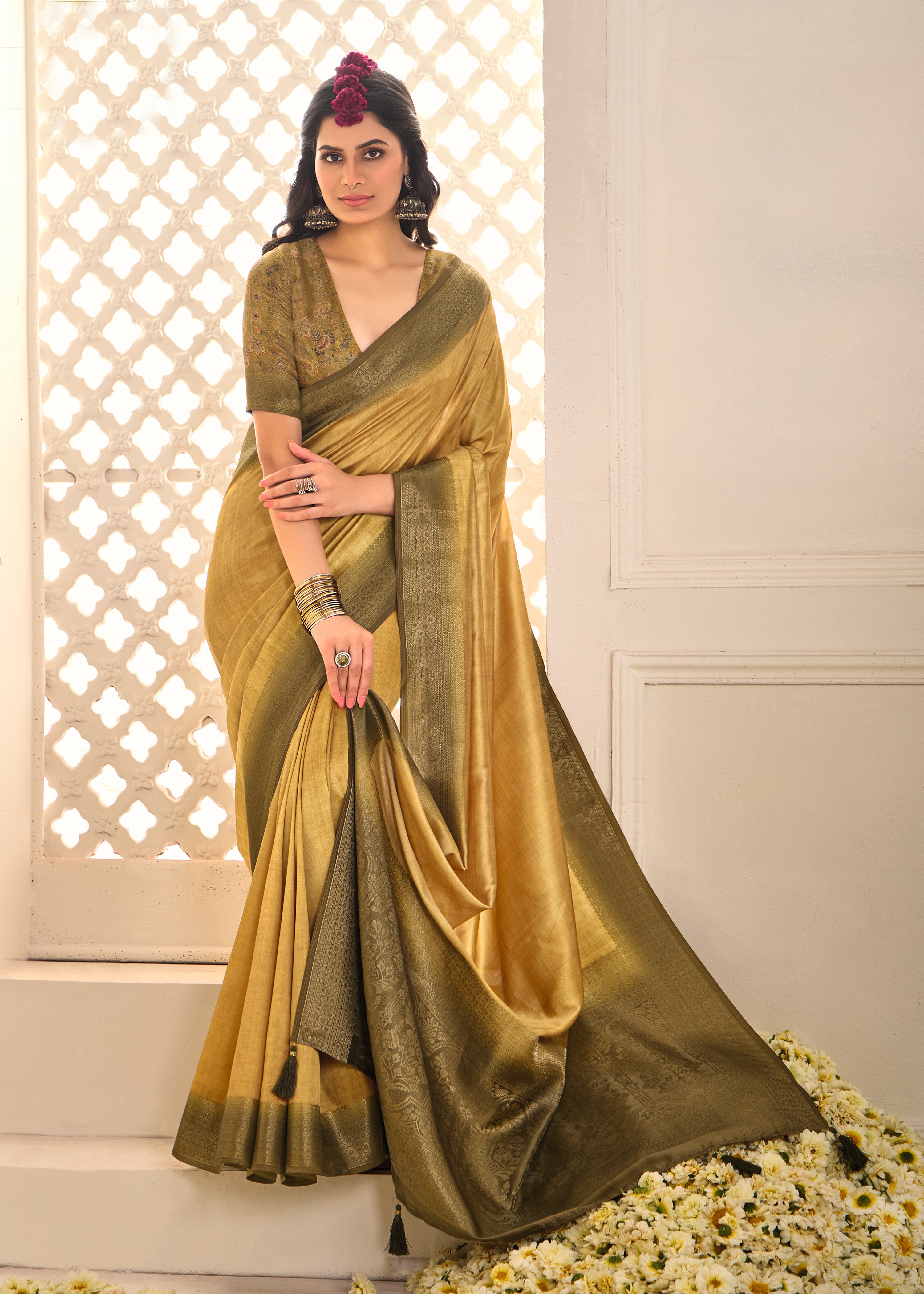 A gold and yellow tissue silk Banarasi style party wear saree