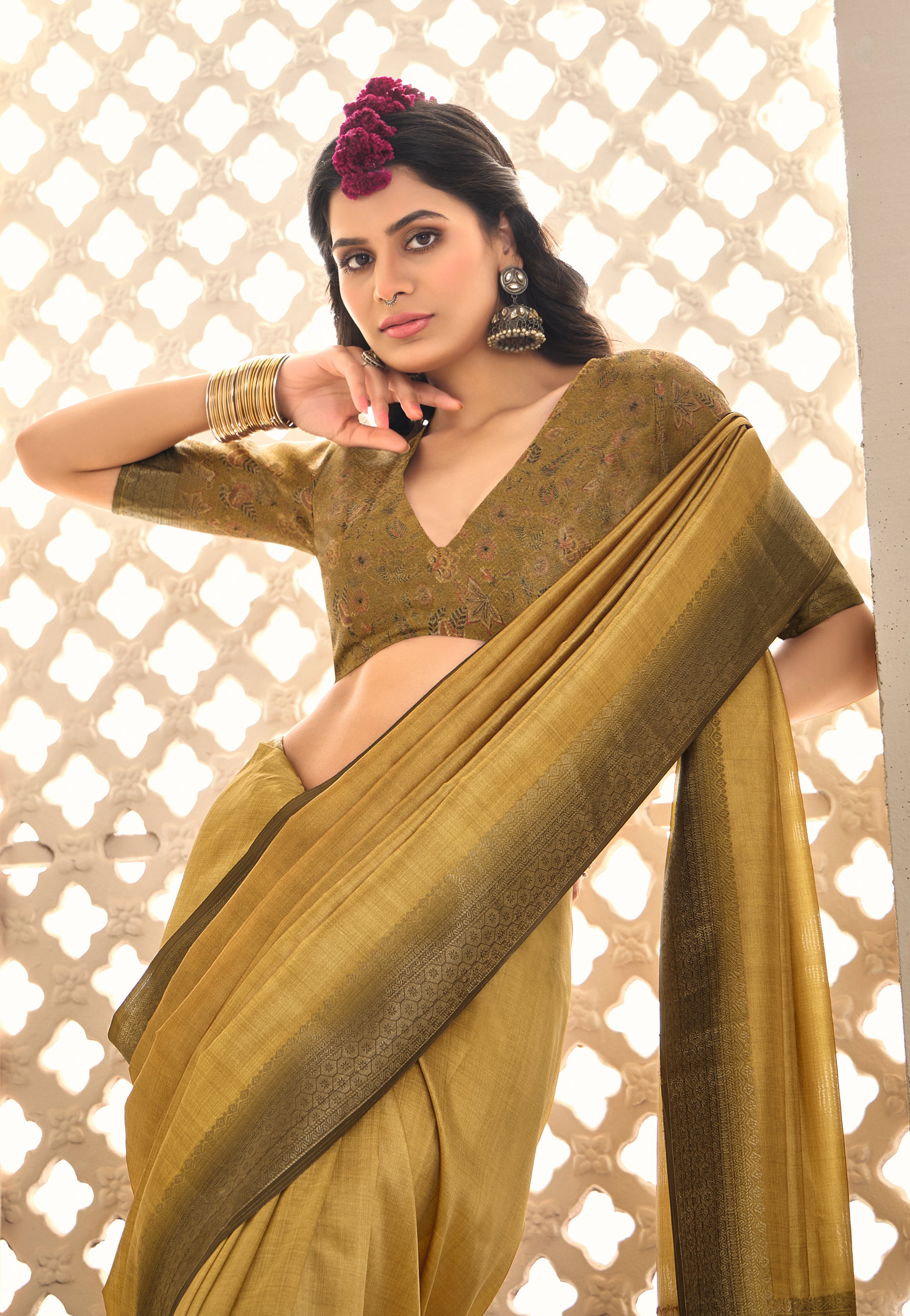 A gold and yellow tissue silk Banarasi style party wear saree