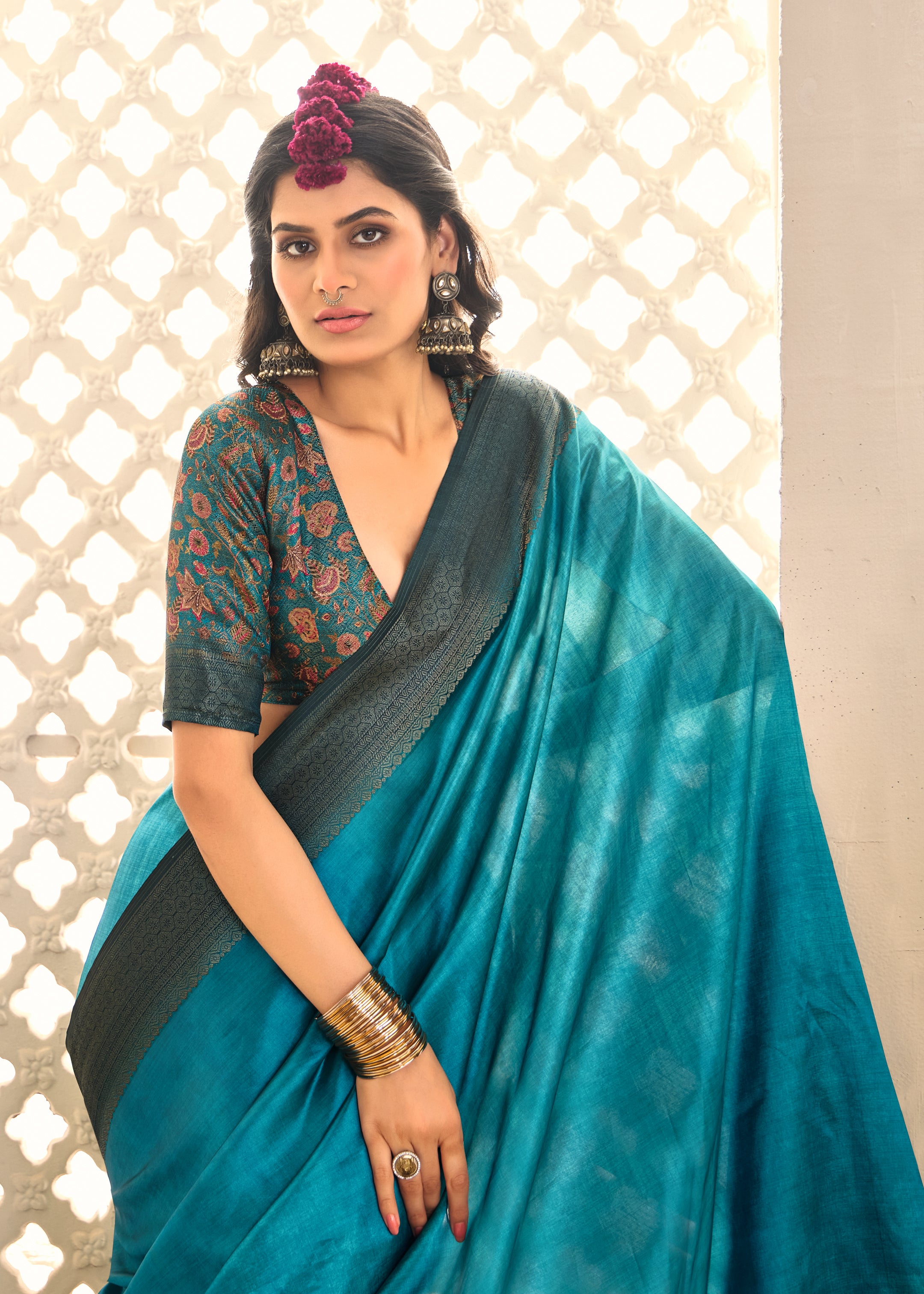 A sky blue and black tissue silk Banarasi style saree