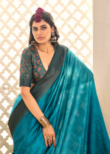 A sky blue and black tissue silk Banarasi style saree